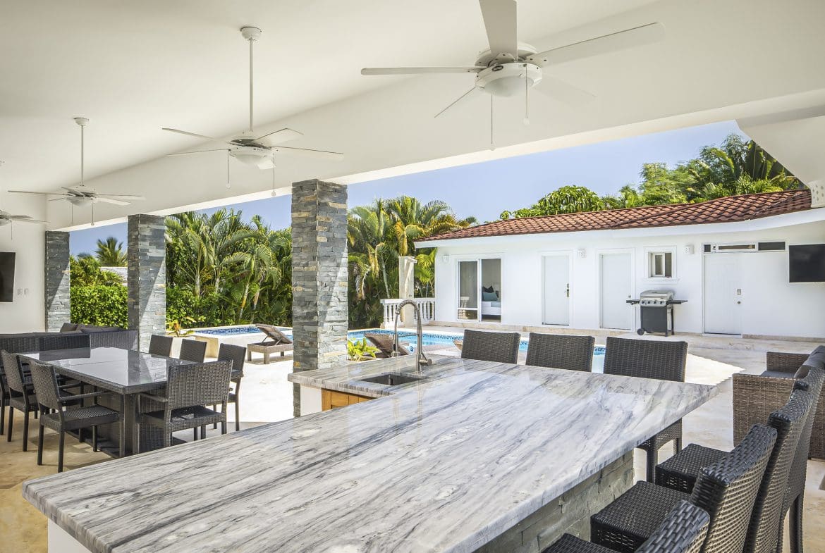 buyDRproperty Outdoor kitchen and dining area in a Villa For Sale in Casa Linda, with pool view. Sosua Real Estate