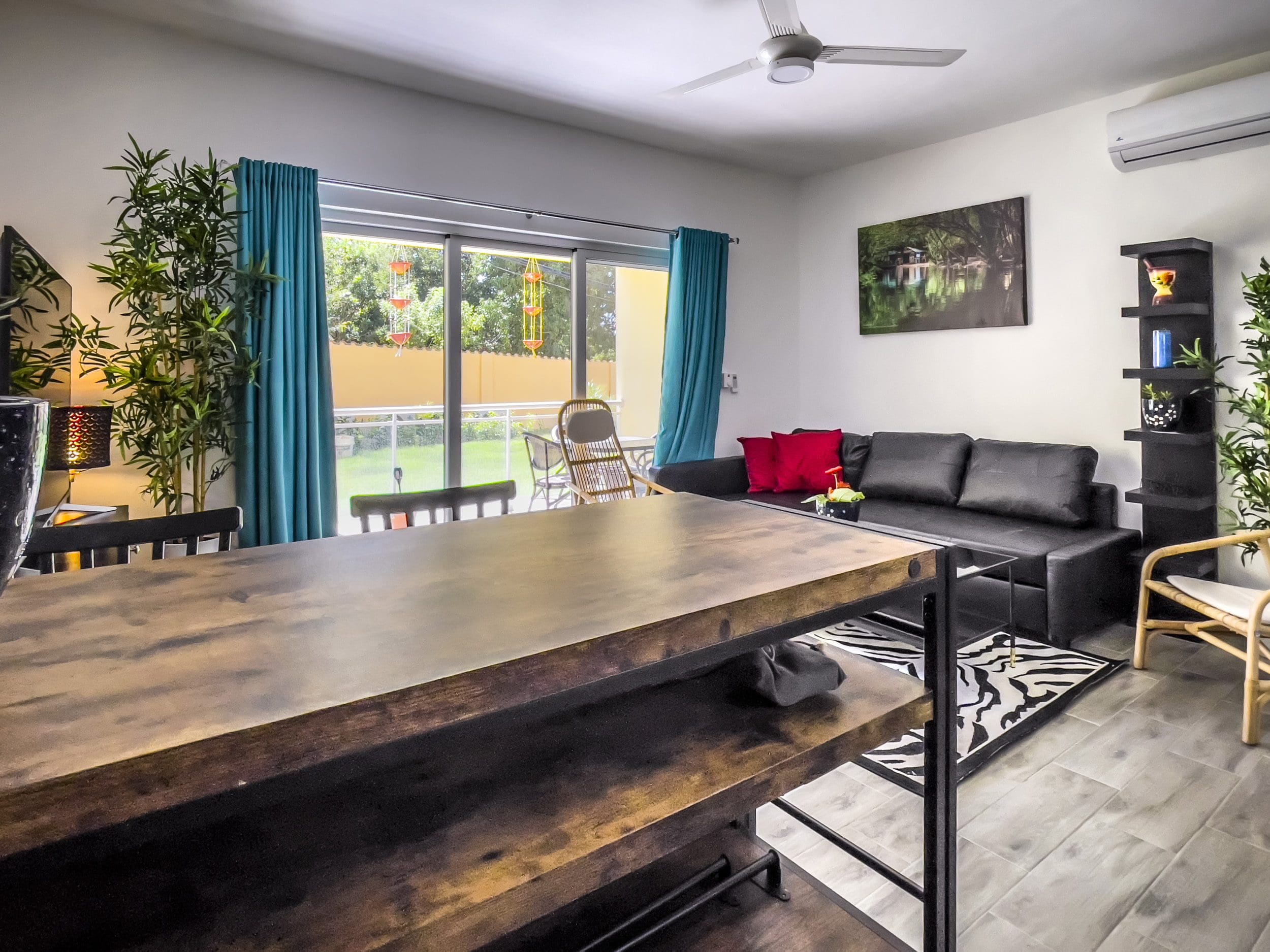 buyDRproperty Modern one-bedroom condo in Sosua, featuring a kitchen island and living room. Sosua Real Estate