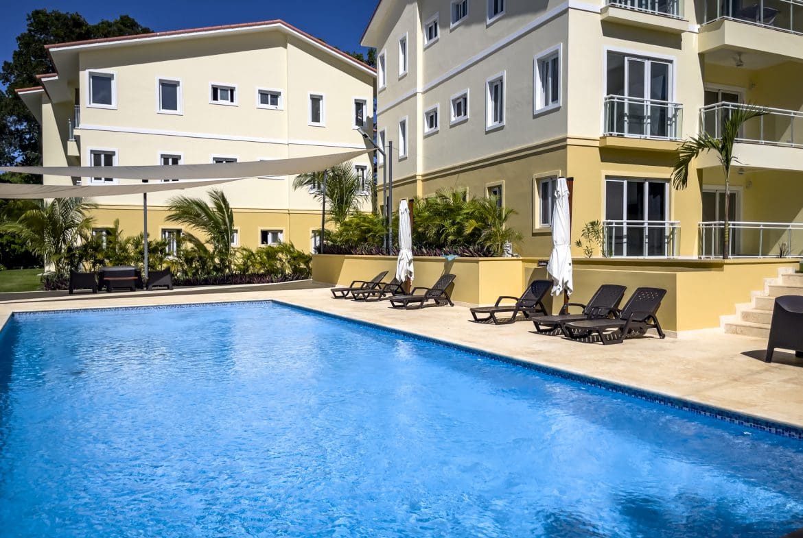 buyDRproperty Swimming pool in front of one bedroom condo in Sosua Sosua Real Estate