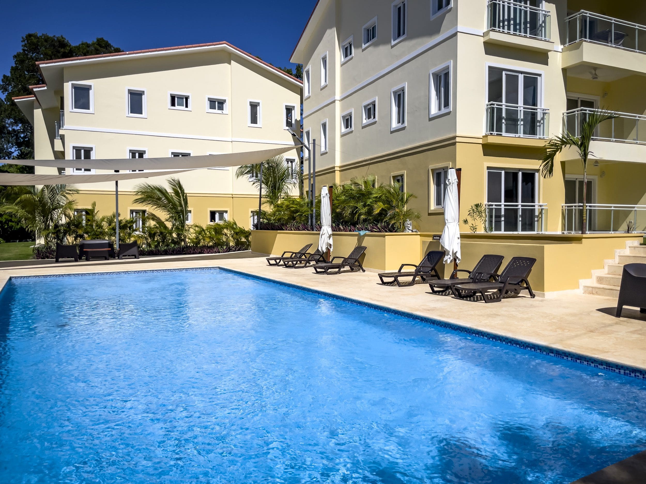 buyDRproperty Swimming pool in front of one bedroom condo in Sosua Sosua Real Estate