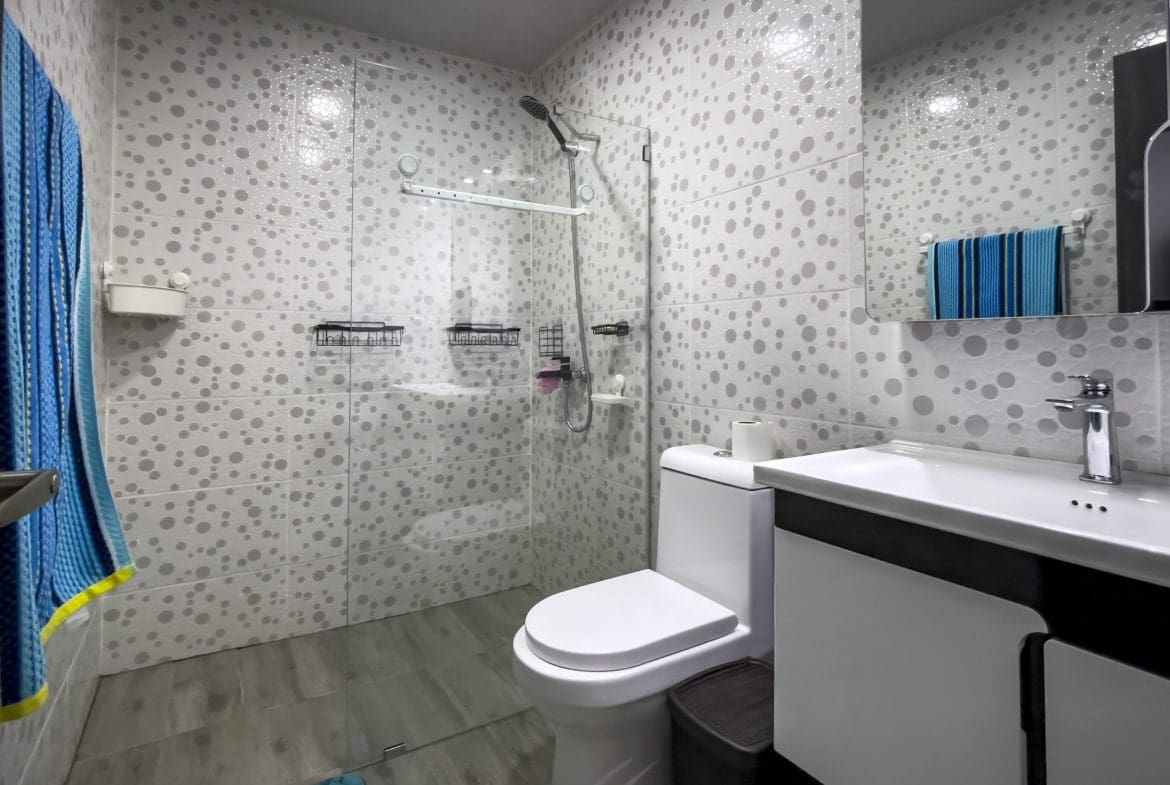 buyDRproperty Modern bathroom with shower and toilet in a one bedroom condo. Sosua Real Estate