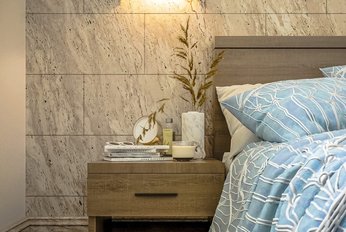 buyDRproperty Bedroom interior with a nightstand, lamp, and blue bedding. 3 bedroom Pre-Construction For Sale. Sosua Real Estate