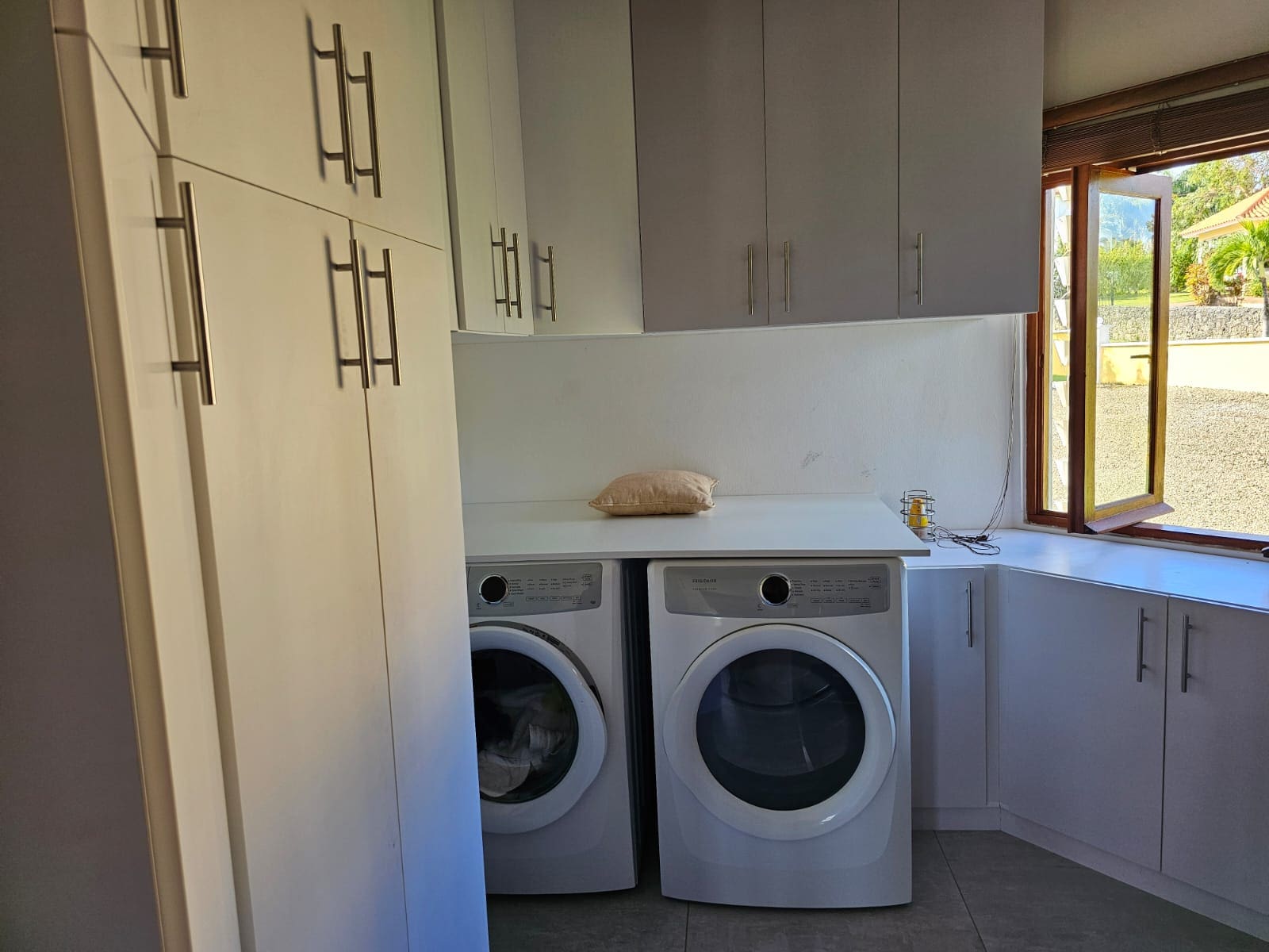 buyDRproperty Laundry room in a villa with modern appliances and storage. Sosua Real Estate