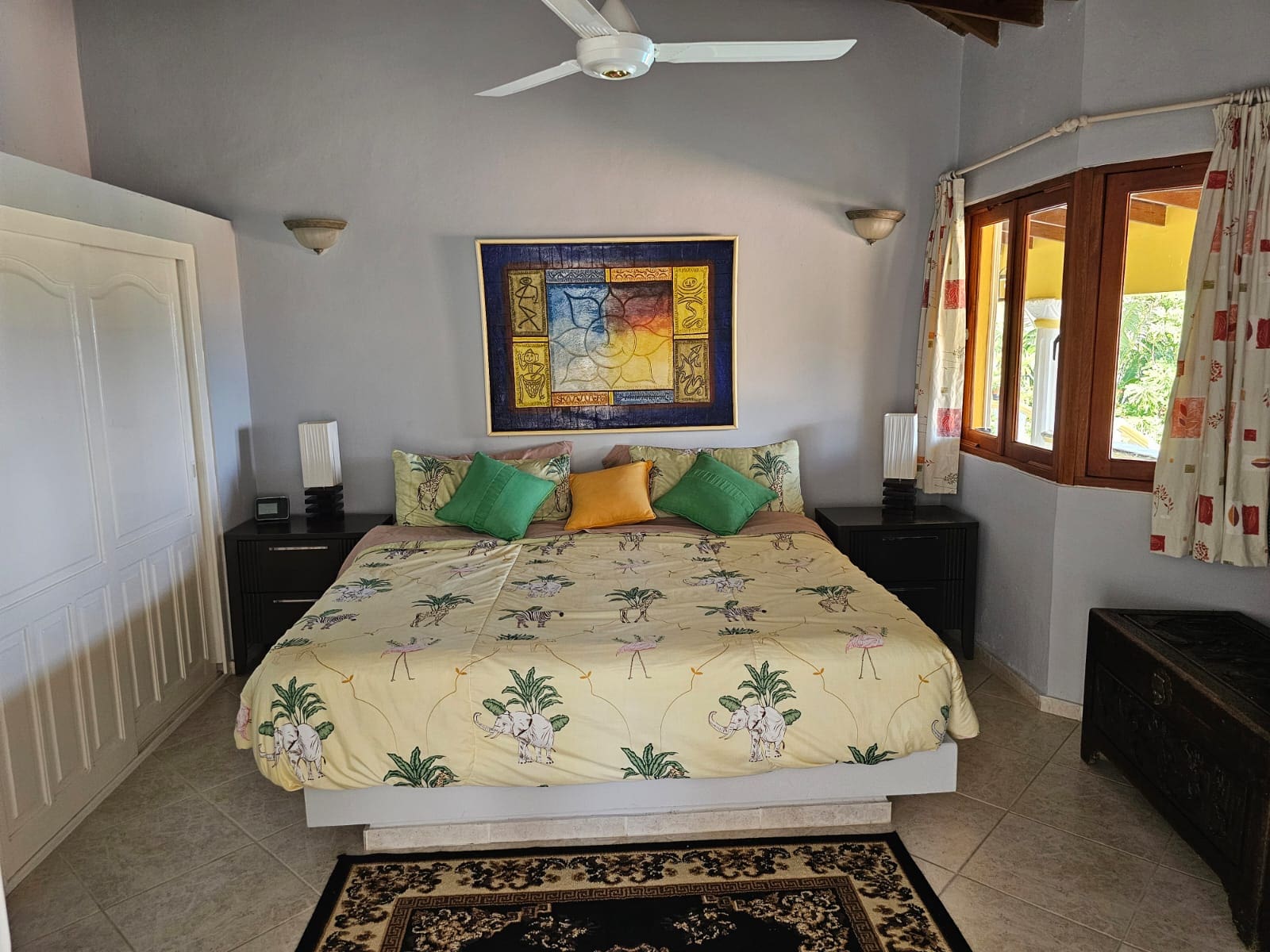 buyDRproperty Bedroom in a villa with elephant-themed bedding and ocean views. Villa for sale. Sosua Real Estate