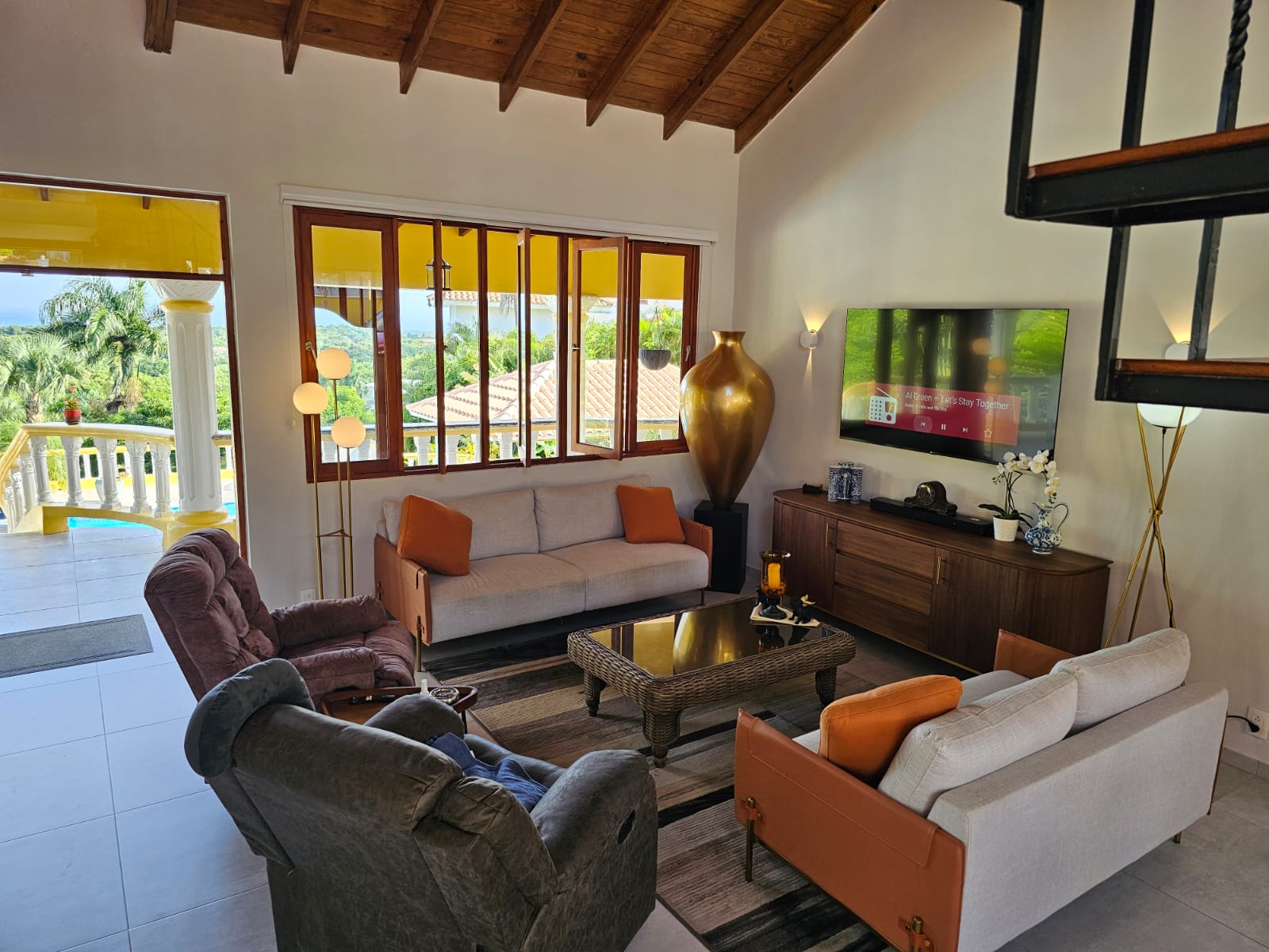 buyDRproperty Living room in villa for sale featuring ocean views, comfortable seating, and modern decor. Sosua Real Estate