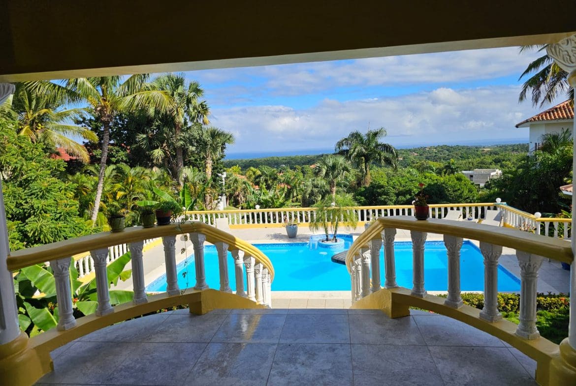 buyDRproperty Ocean views from a luxury villa overlooking a pool in Panorama Village. Sosua Real Estate