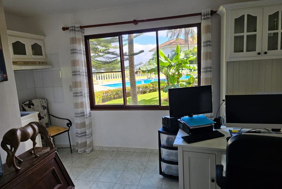 buyDRproperty Home office with ocean view from a Villa For Sale in Sosua. Features a pool and lush landscaping. Sosua Real Estate