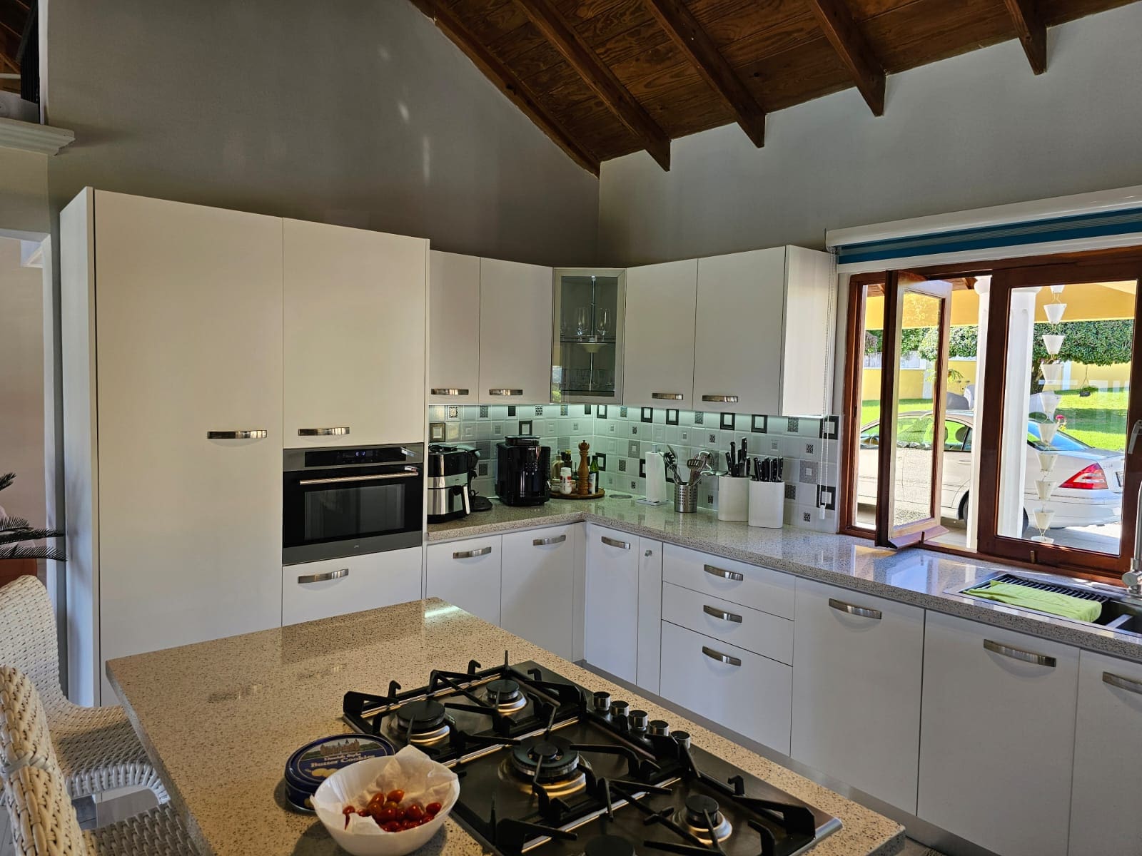 buyDRproperty Modern kitchen in a luxury villa, showcasing countertops and appliances. Ocean Views villa for sale. Sosua Real Estate