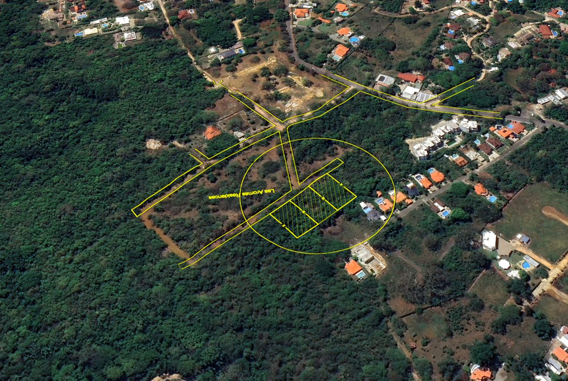 buyDRproperty Aerial view of building lots for sale in La Mulata, with planned roads and surrounding trees. Sosua Real Estate