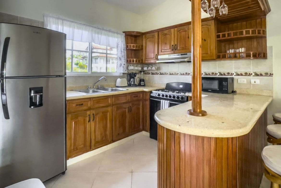 buyDRproperty Kitchen interior with stainless steel refrigerator in 3BR Ocean View Home, Hispaniola Sosua Real Estate