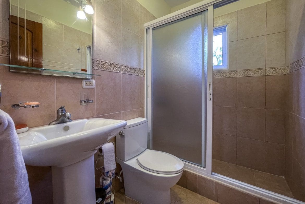 buyDRproperty Bathroom with sink, toilet, and shower in a 3BR Ocean View Home in Hispaniola. Sosua Real Estate