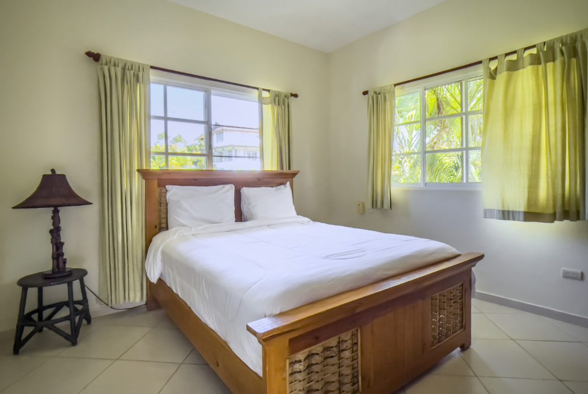 buyDRproperty Bedroom with a large bed in a 3BR Ocean View Home, Hispaniola Sosua Real Estate