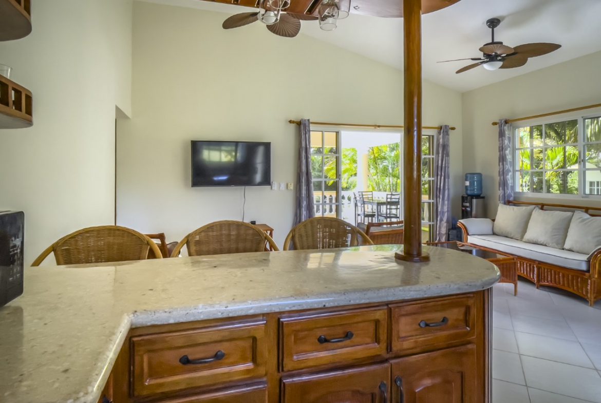 buyDRproperty Interior of a 3BR Ocean View Home, Hispaniola, with bar and living area. Sosua Real Estate