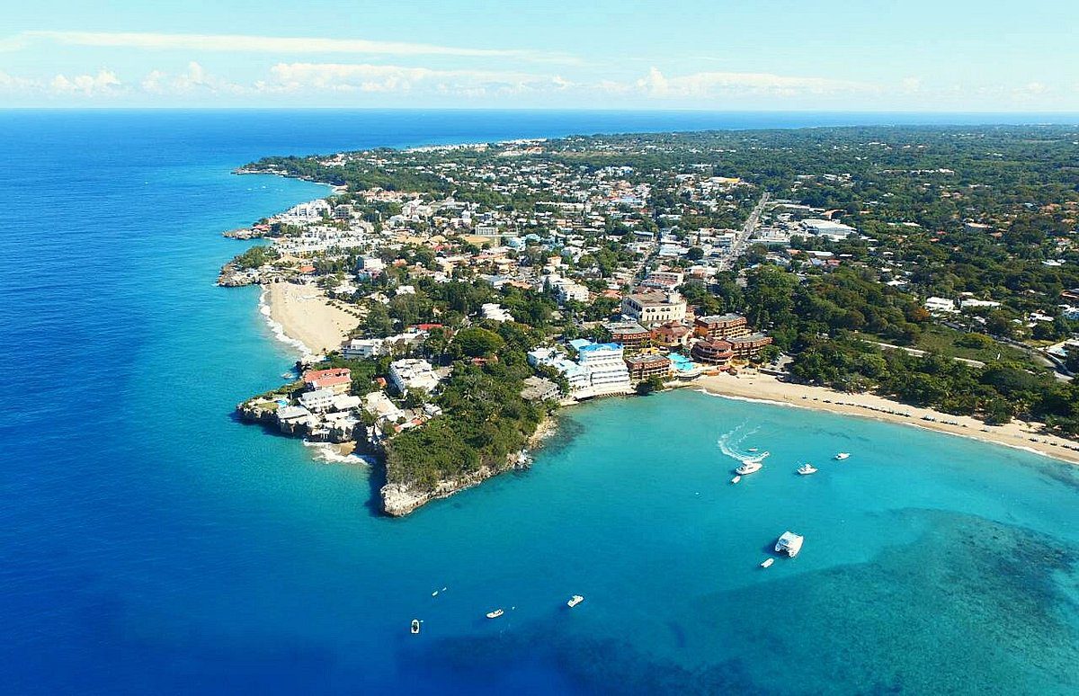 buyDRproperty Aerial view of the North Coast DR with turquoise water and a beach Sosua Real Estate