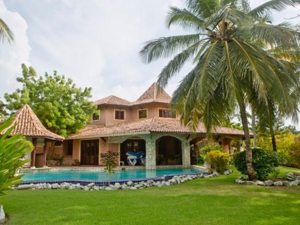 buyDRproperty Villa Estrella del Caribe with a pool and lush tropical landscaping. Sosua Real Estate