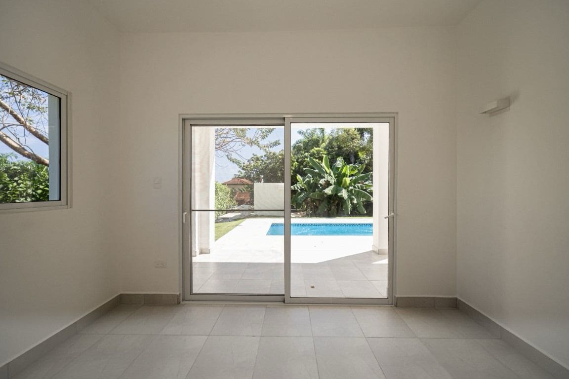 buyDRproperty Home for sale in Sosua: Interior view with sliding doors to pool. Sosua Real Estate