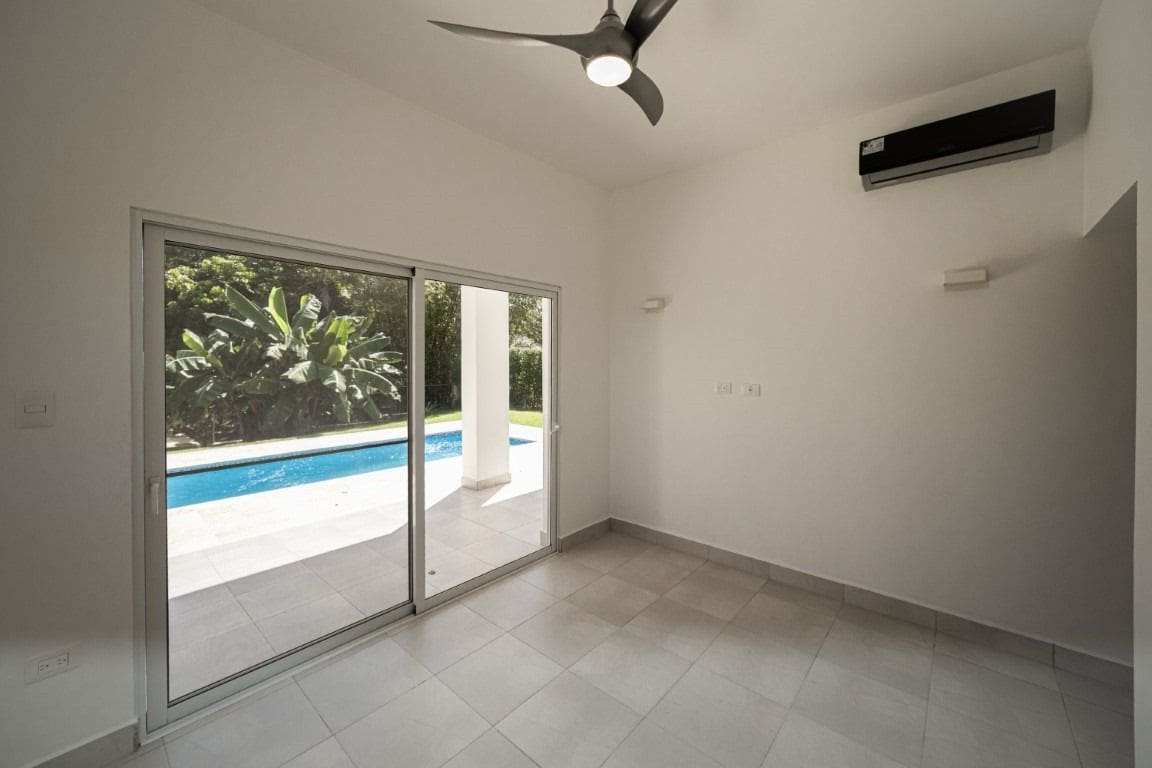 buyDRproperty Bright modern home for sale in Sosua with pool view and sliding glass doors. Sosua Real Estate