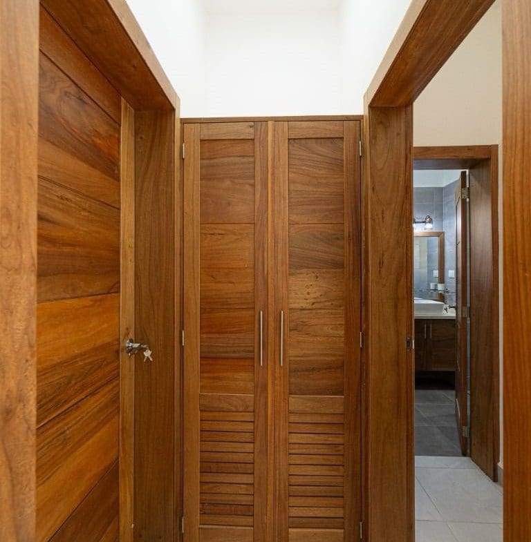 buyDRproperty Wooden doors and hallway in a beautiful home for sale. Sosua Real Estate