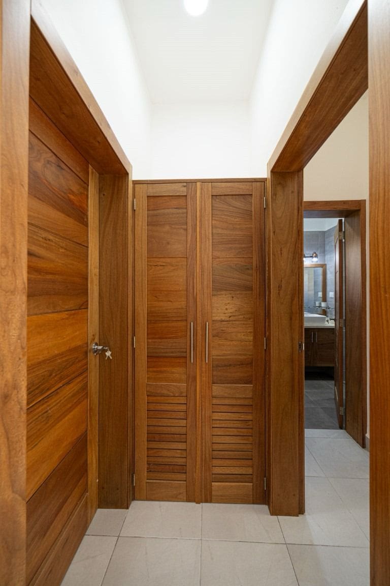 buyDRproperty Wooden doors and hallway in a beautiful home for sale. Sosua Real Estate