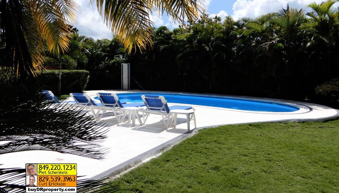 buyDRproperty Casa Linda Villa for sale with pool and lounge chairs. Sosua Real Estate