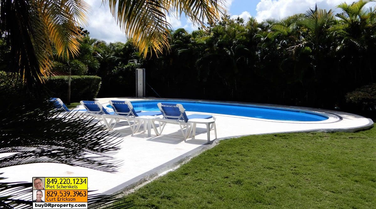 buyDRproperty Casa Linda Villa for sale with pool and lounge chairs. Sosua Real Estate