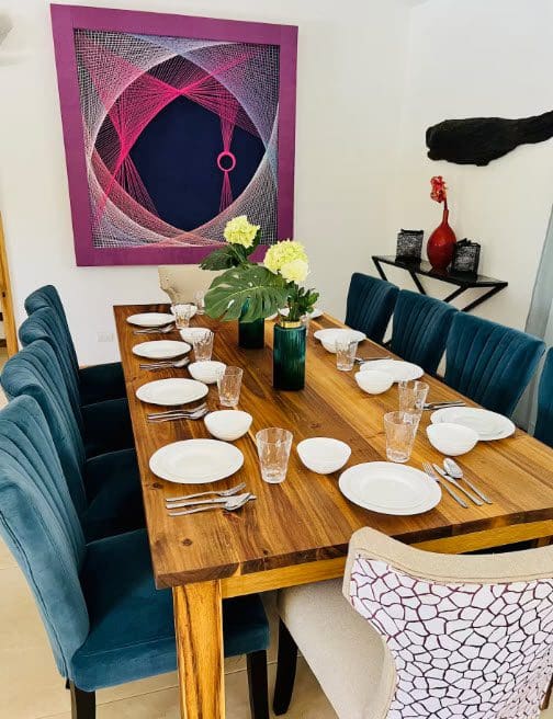 buyDRproperty Dining room table set for a meal at a beautiful 9-Bedroom Villa. Sosua Real Estate