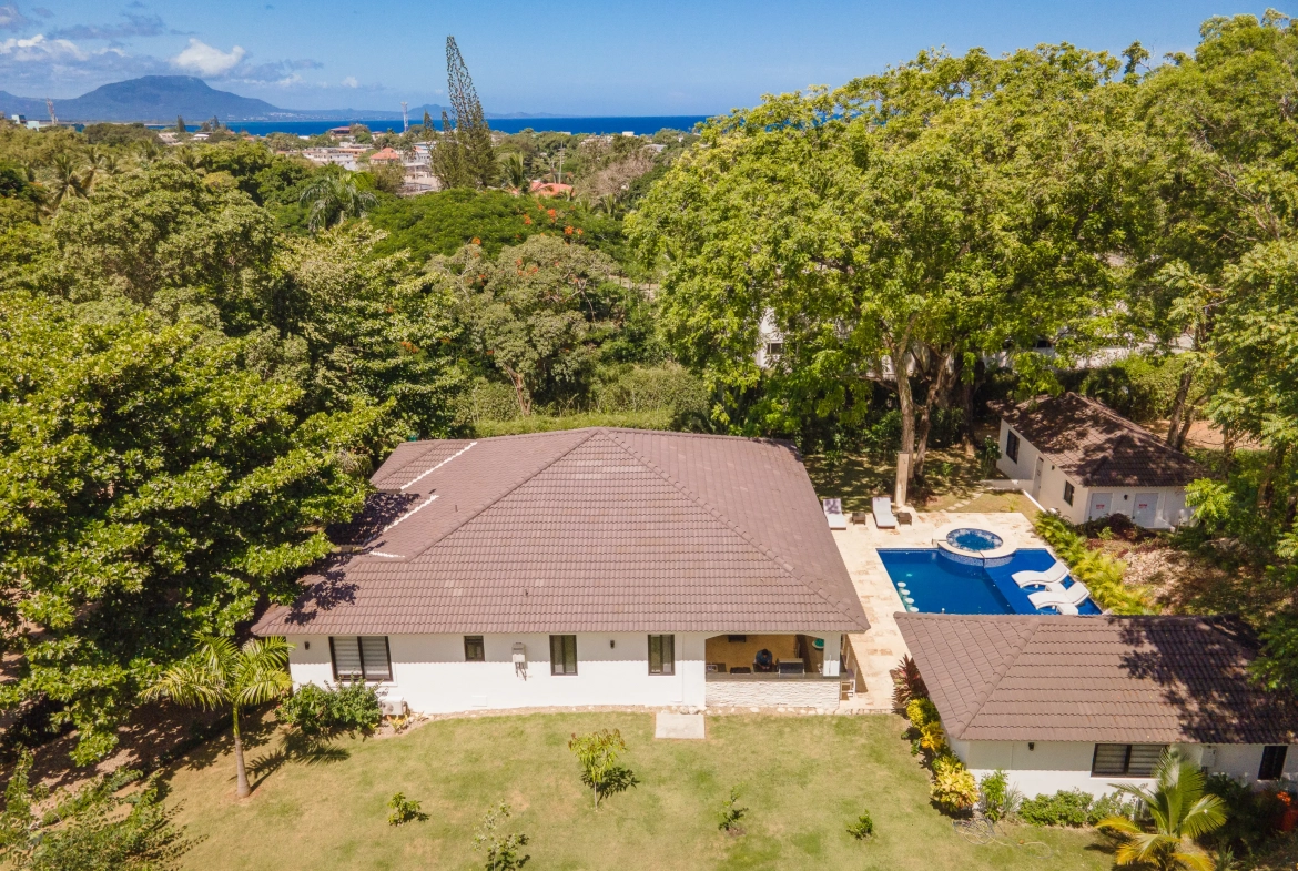 buyDRproperty Aerial view of a luxury villa with a pool, part of the Hispaniola Residential Sosua Real Estate