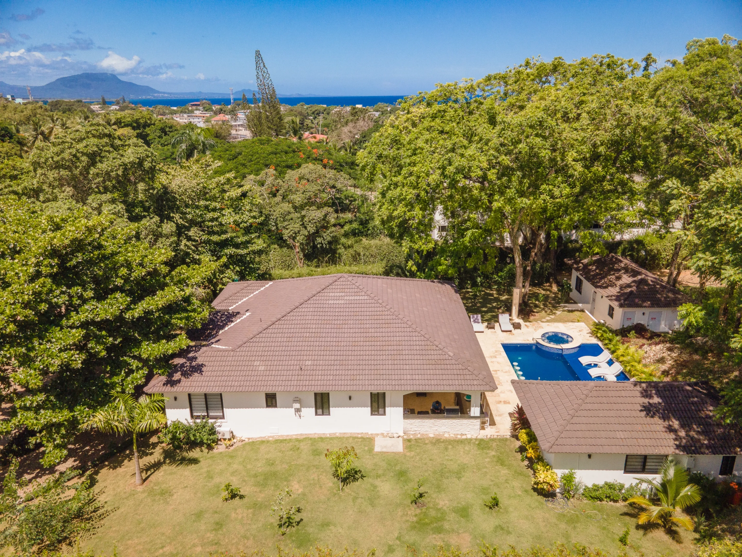 buyDRproperty Aerial view of a luxury villa with a pool, part of the Hispaniola Residential Sosua Real Estate