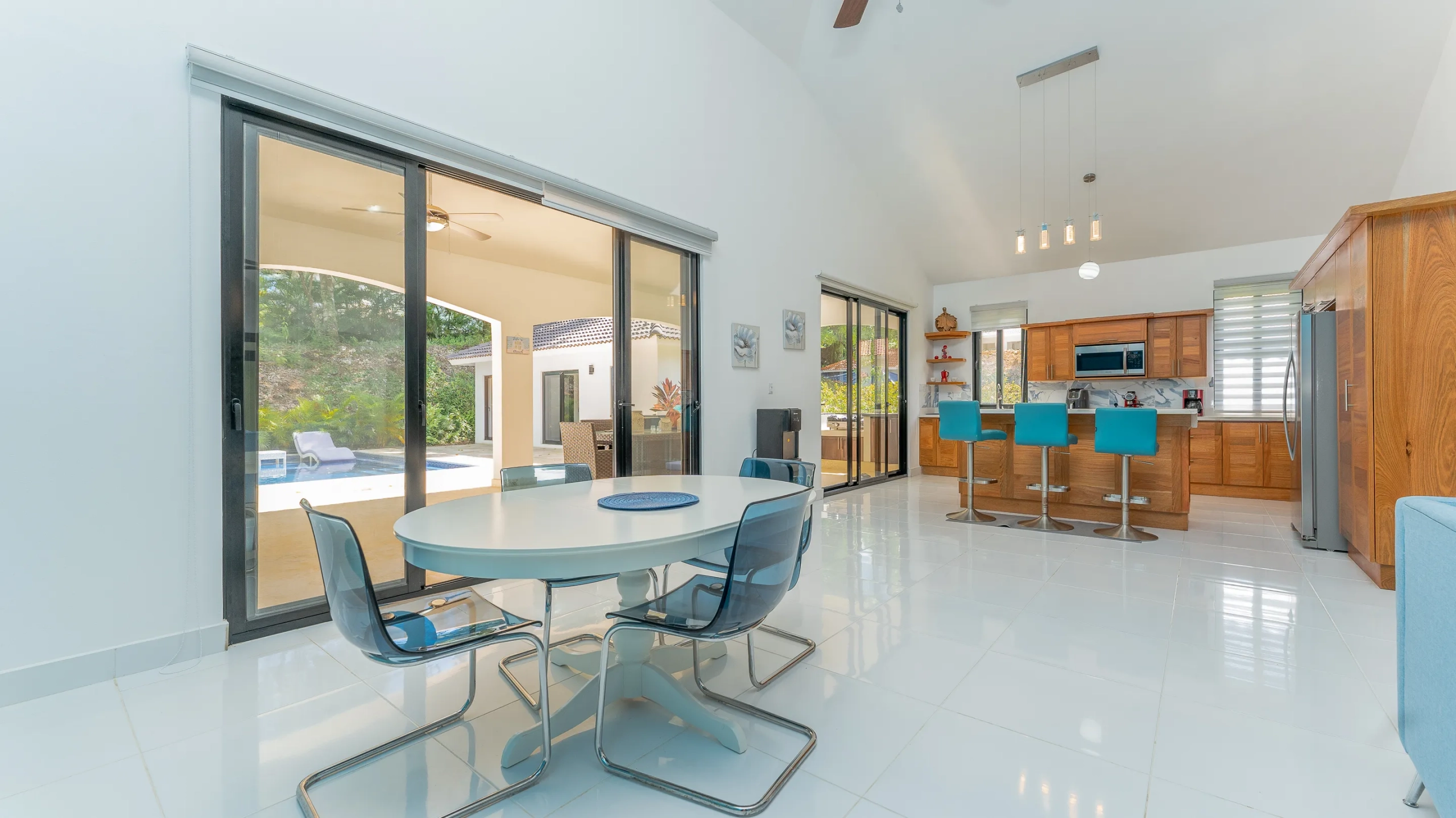 buyDRproperty Dining area with white table and transparent chairs, part of the Stunning 4 Bedroom Villa In Hispaniola Residential Sosua Real Estate