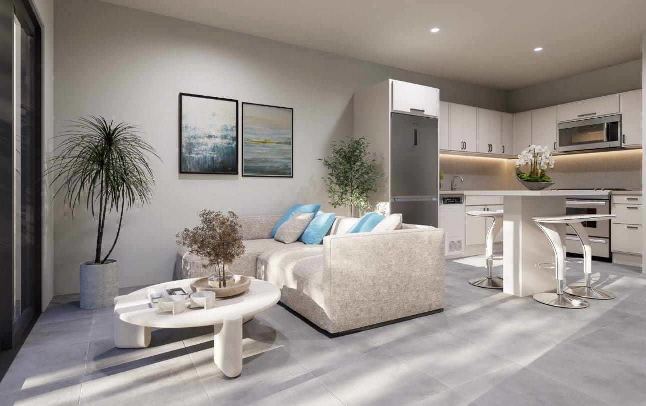 buyDRproperty Stylish townhouse living room with sectional sofa and modern kitchen Sosua Real Estate