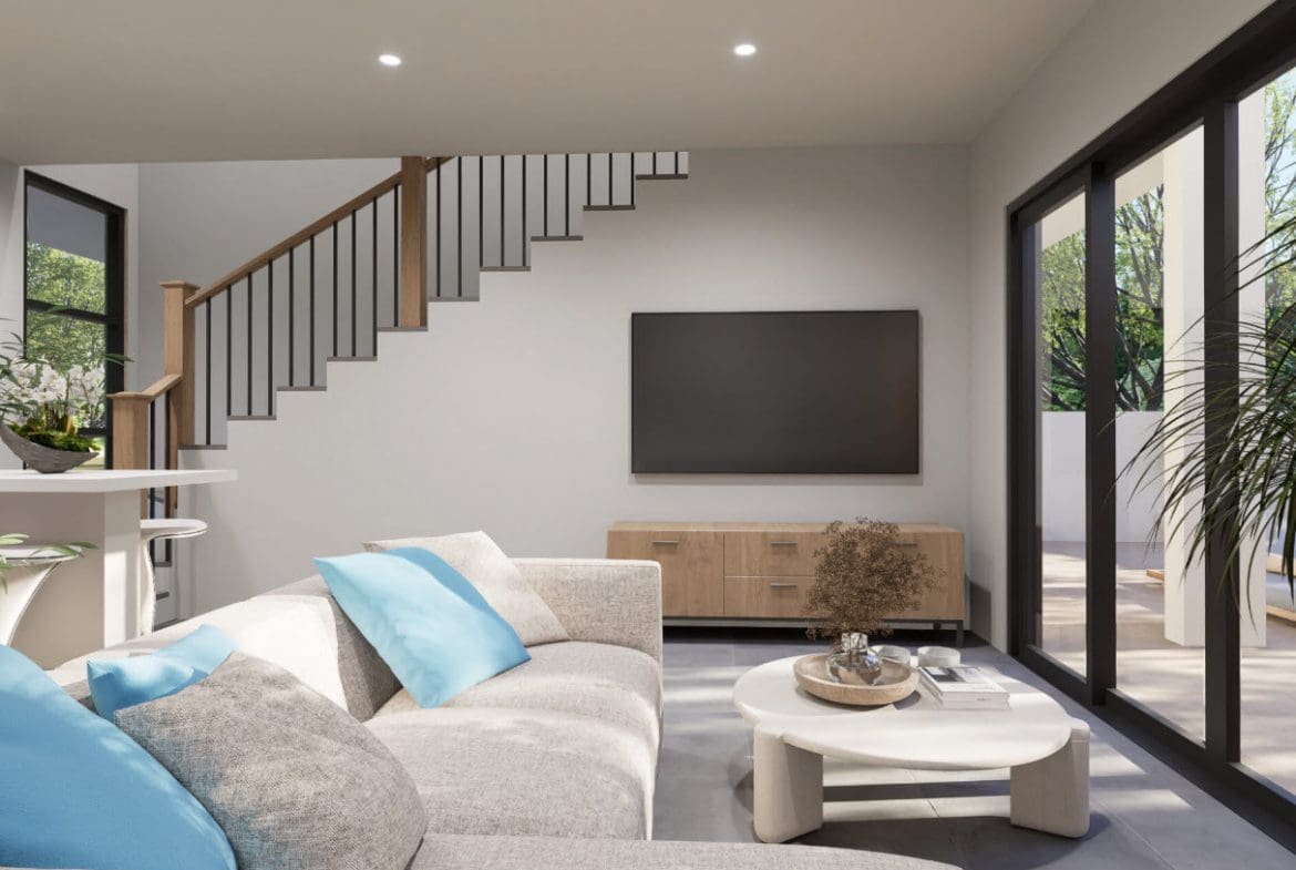 buyDRproperty Living room with a staircase, television, and a view of a patio in a Casa Linda townhouse. Sosua Real Estate