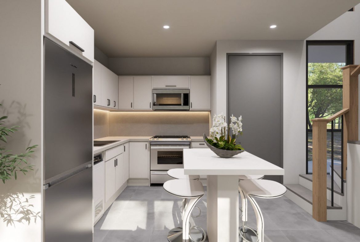 buyDRproperty Modern kitchen with white cabinets, stainless steel appliances, and a breakfast bar in a Casa Linda townhouse. Sosua Real Estate