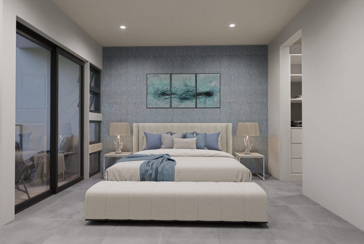 buyDRproperty Modern bedroom in a townhouse with a large bed, bench, and blue accents. Sosua Real Estate