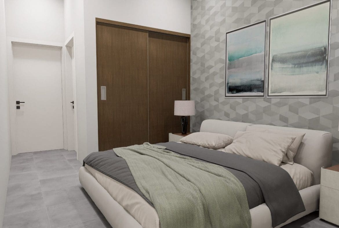 buyDRproperty Modern bedroom in a Casa Linda townhouse with artwork and sliding closet doors. Sosua Real Estate