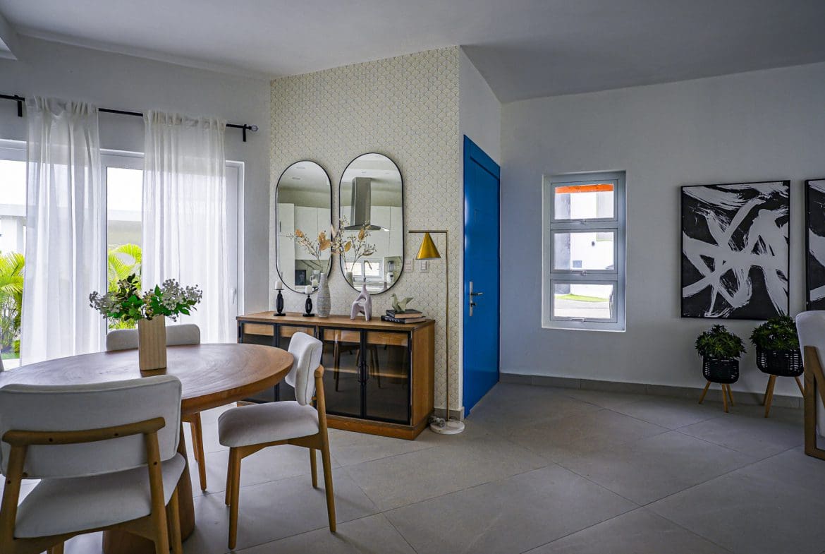 buyDRproperty Modern dining room in a Sosua Ocean Village villa with round table and chairs. Sosua Real Estate