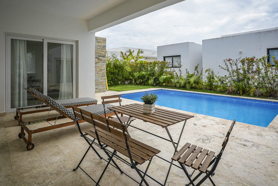buyDRproperty Modern villa with a pool and outdoor seating Sosua Real Estate