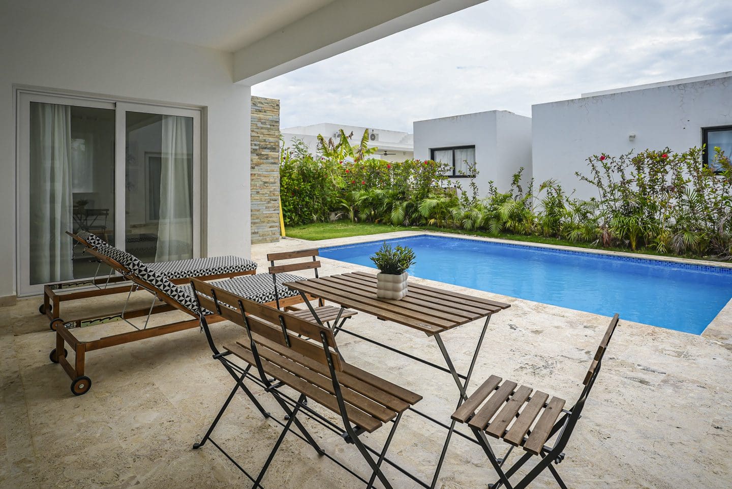 buyDRproperty Modern villa with a pool and outdoor seating Sosua Real Estate