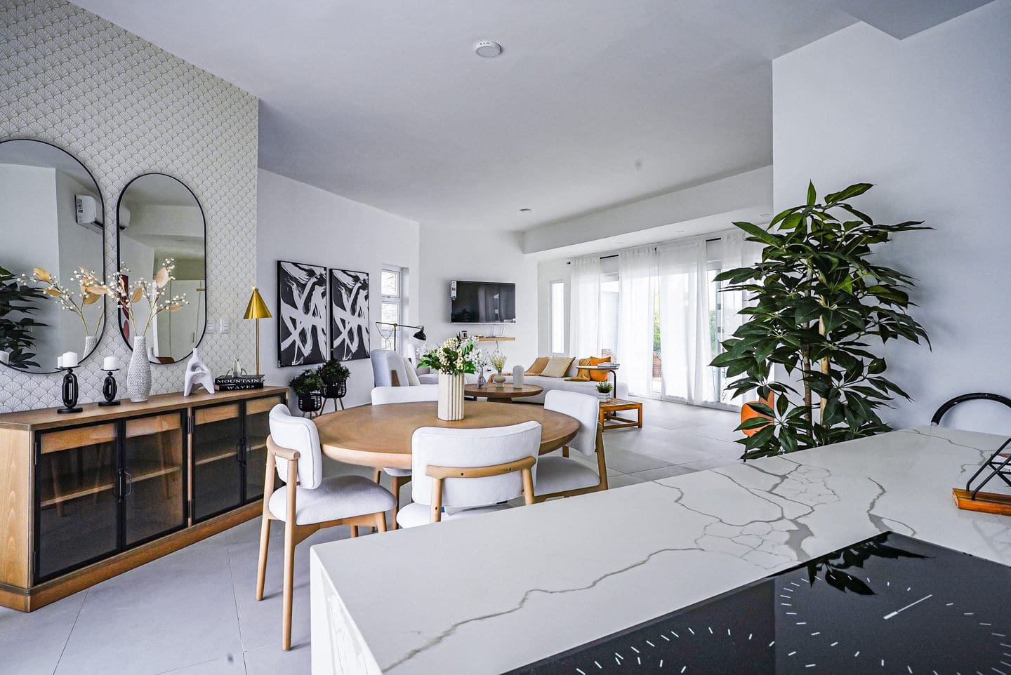 buyDRproperty Modern living room with dining area and kitchen island in a villa Sosua Real Estate