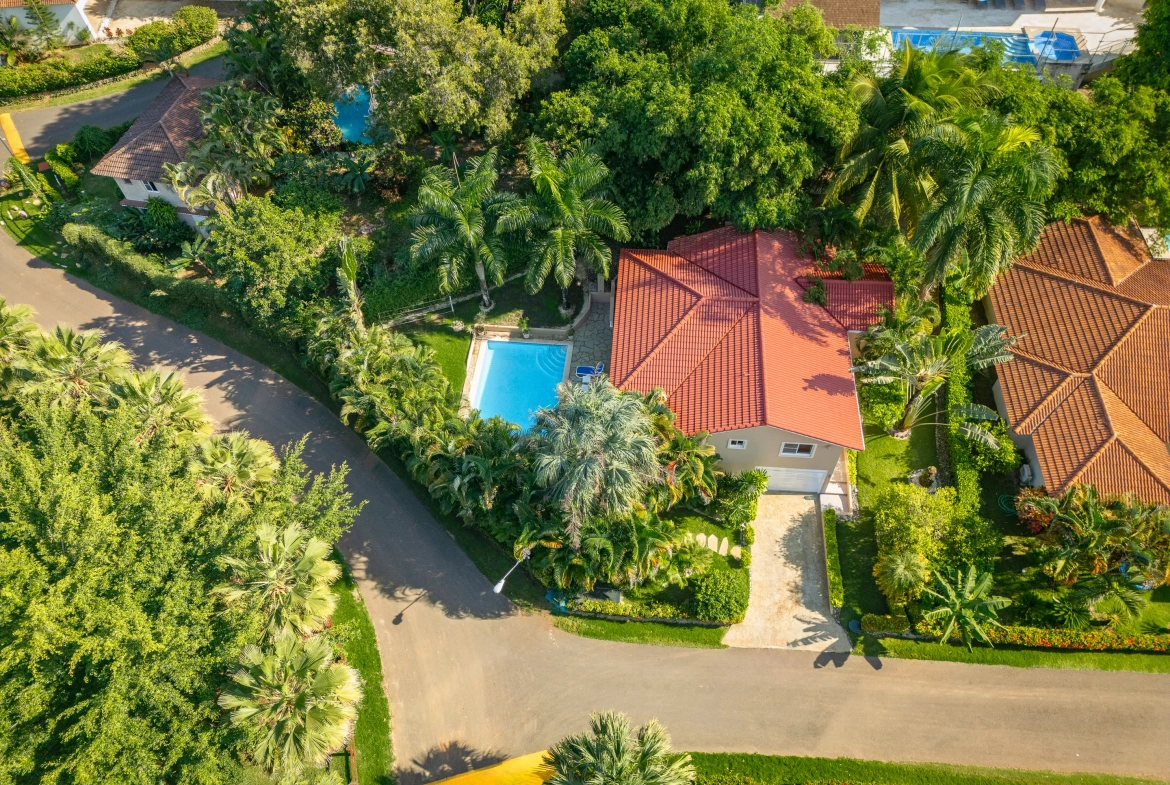 buyDRproperty Aerial view of a beautiful 3-bedroom villa in Sosua with a red tile roof and a pool Sosua Real Estate