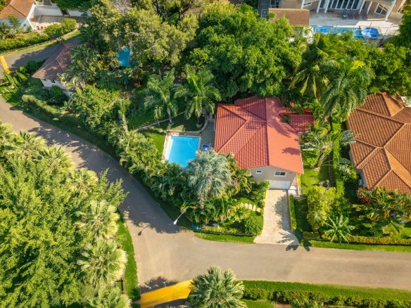 buyDRproperty Aerial view of a beautiful 3-bedroom villa in Sosua with a red tile roof and a pool Sosua Real Estate
