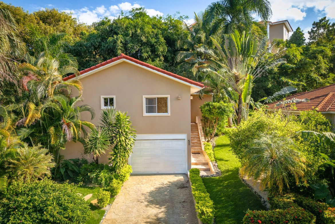 buyDRproperty Beautiful Sosua 3-bedroom villa with garage surrounded by lush tropical landscaping. Sosua Real Estate