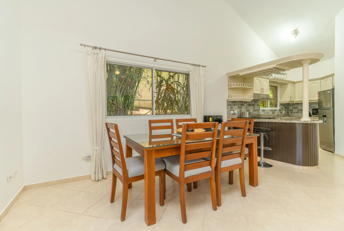 buyDRproperty Dining area in a 3-bedroom villa, table with chairs next to the kitchen Sosua Real Estate