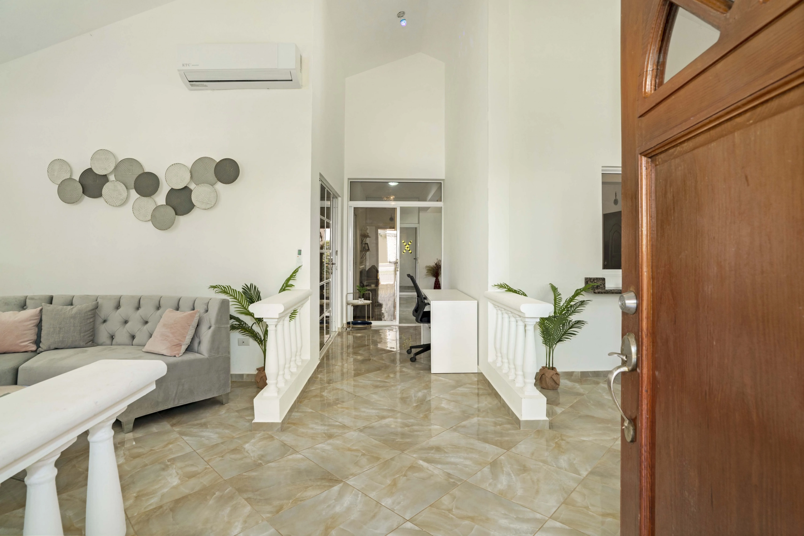 buyDRproperty Beautiful home interior with open door and hallway Sosua Real Estate