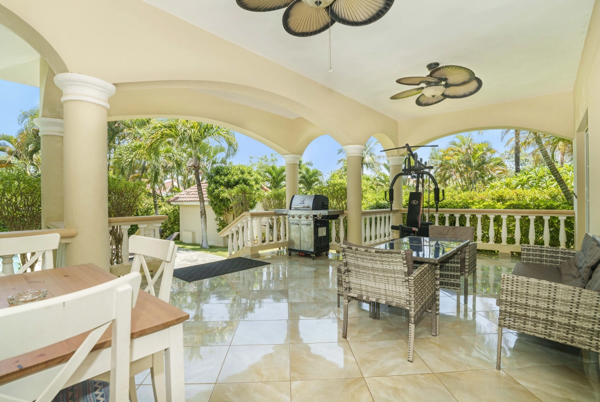 buyDRproperty Beautiful outdoor patio with seating, grill, and exercise equipment. Sosua Real Estate