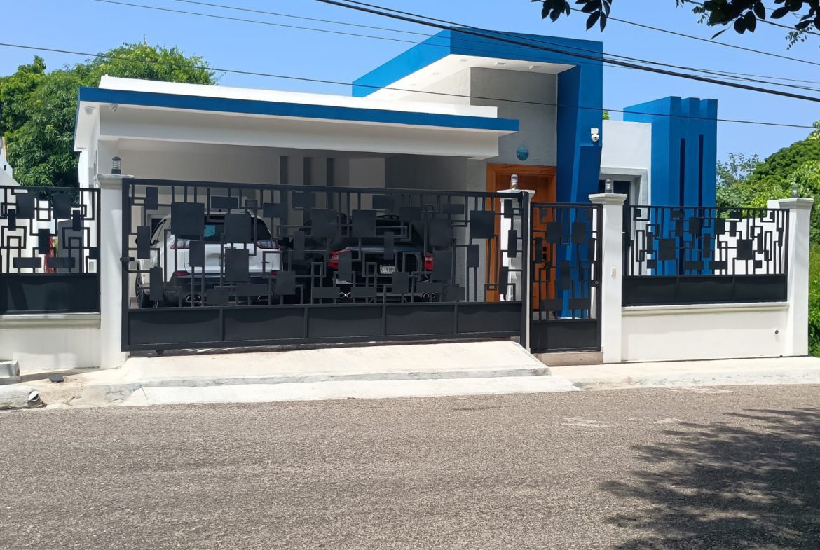 buyDRproperty Modern villa in Puerto Plata with blue accents and black gate Sosua Real Estate