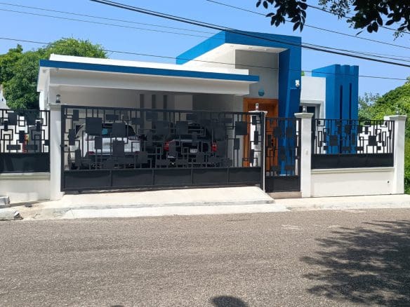 buyDRproperty Modern villa in Puerto Plata with blue accents and black gate Sosua Real Estate