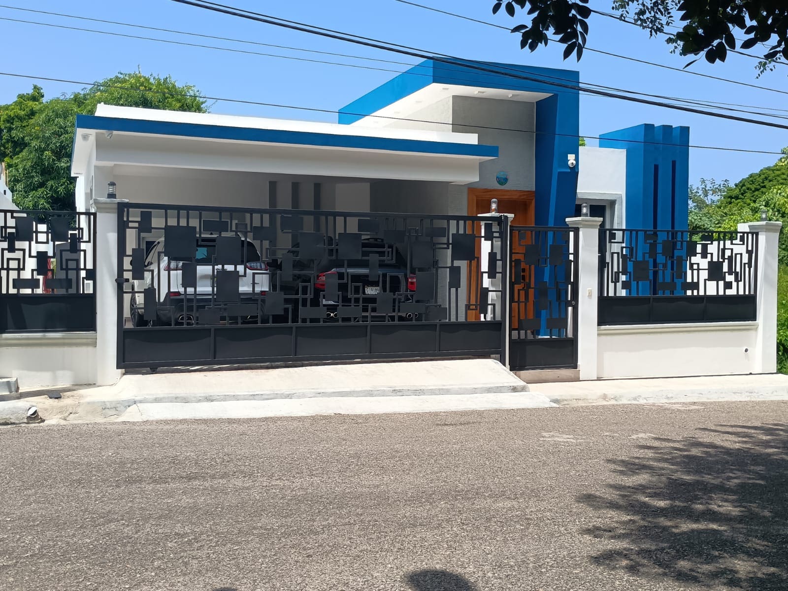 buyDRproperty Modern villa in Puerto Plata with blue accents and black gate Sosua Real Estate