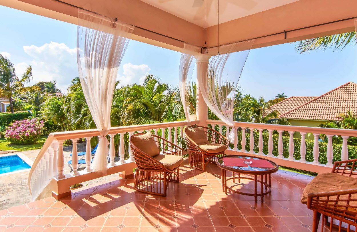 buyDRproperty Balcony of a villa for sale in Residential Hispaniola with seating and a view. Sosua Real Estate