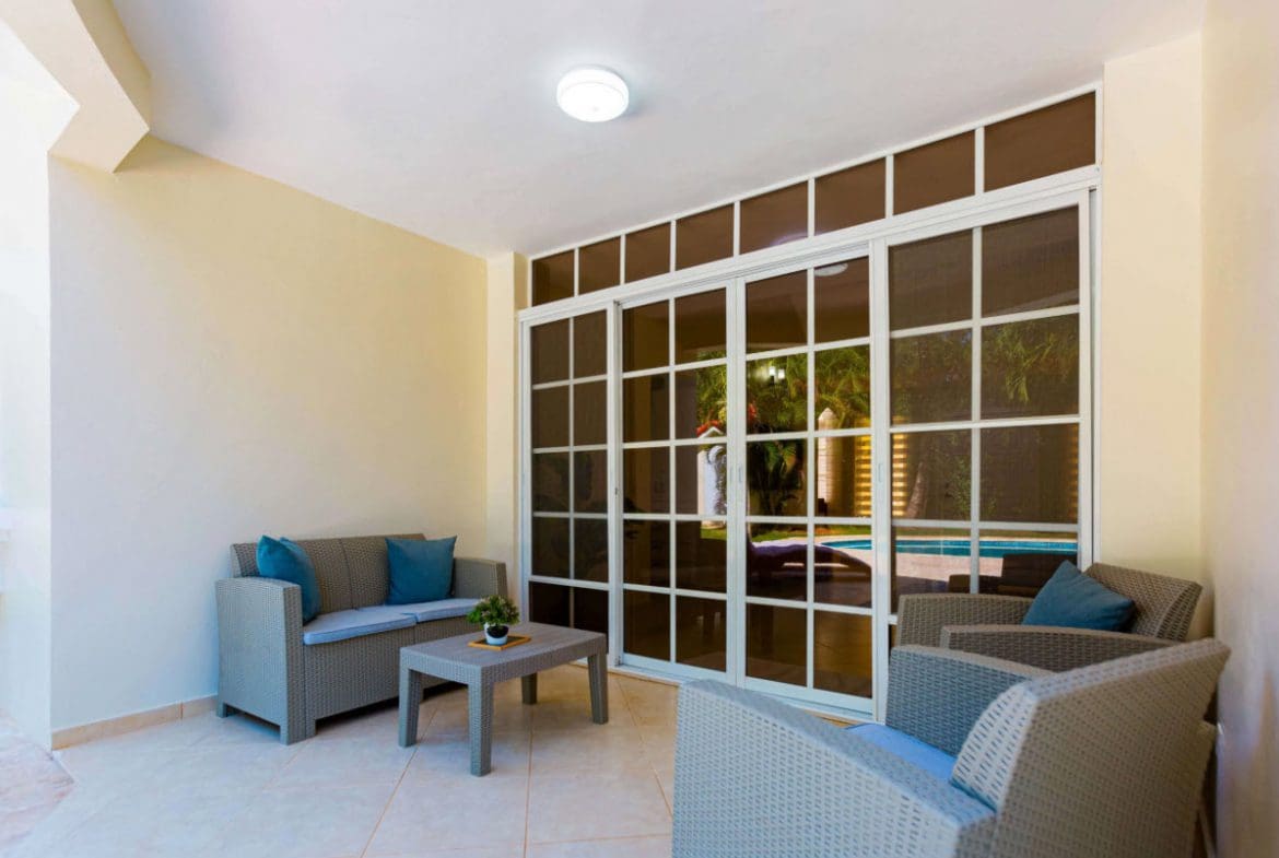 buyDRproperty Outdoor seating area of a 3 BR Villa with pool in Sosúa Sosua Real Estate