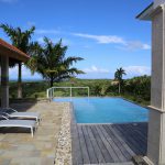 Buydrproperty Infinity Pool with Lounge Chairs Overlooking Tropical Landscape Sosua Real Estate Buydrpropertycom Buydrpropertycom